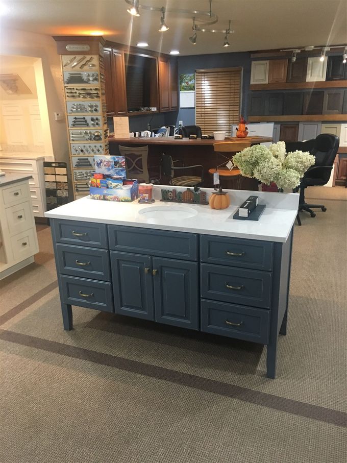 Distressed Cadet Blue Vanity By Brighton Cabinetry.  We can do custom colors from Sherwin Williams or Benjamin Moore or any paint supplier you have a sample of.