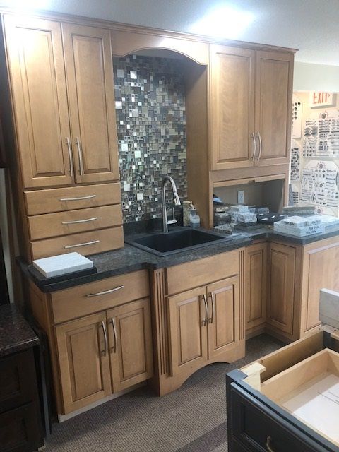Recently SOLD but we have others. Birch Display $995.00 with Counter Top, Sink, Faucet and Hardware.